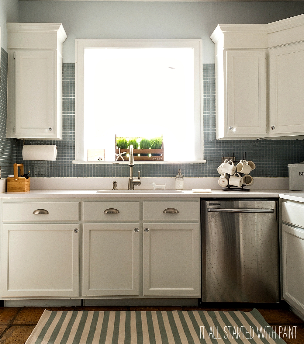 http://www.itallstartedwithpaint.com/wp-content/uploads/2015/08/white-kitchen-cabinets-white-counter-tops-blue-gray-backsplash-1-of-21-2.jpg