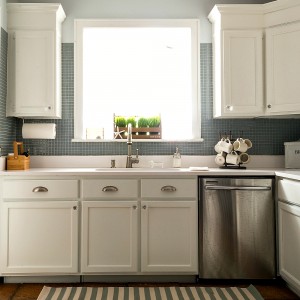 White Kitchen with Painted Builder Grade Cabinets, Blue Gray Tile Back Splash, White Counter Top