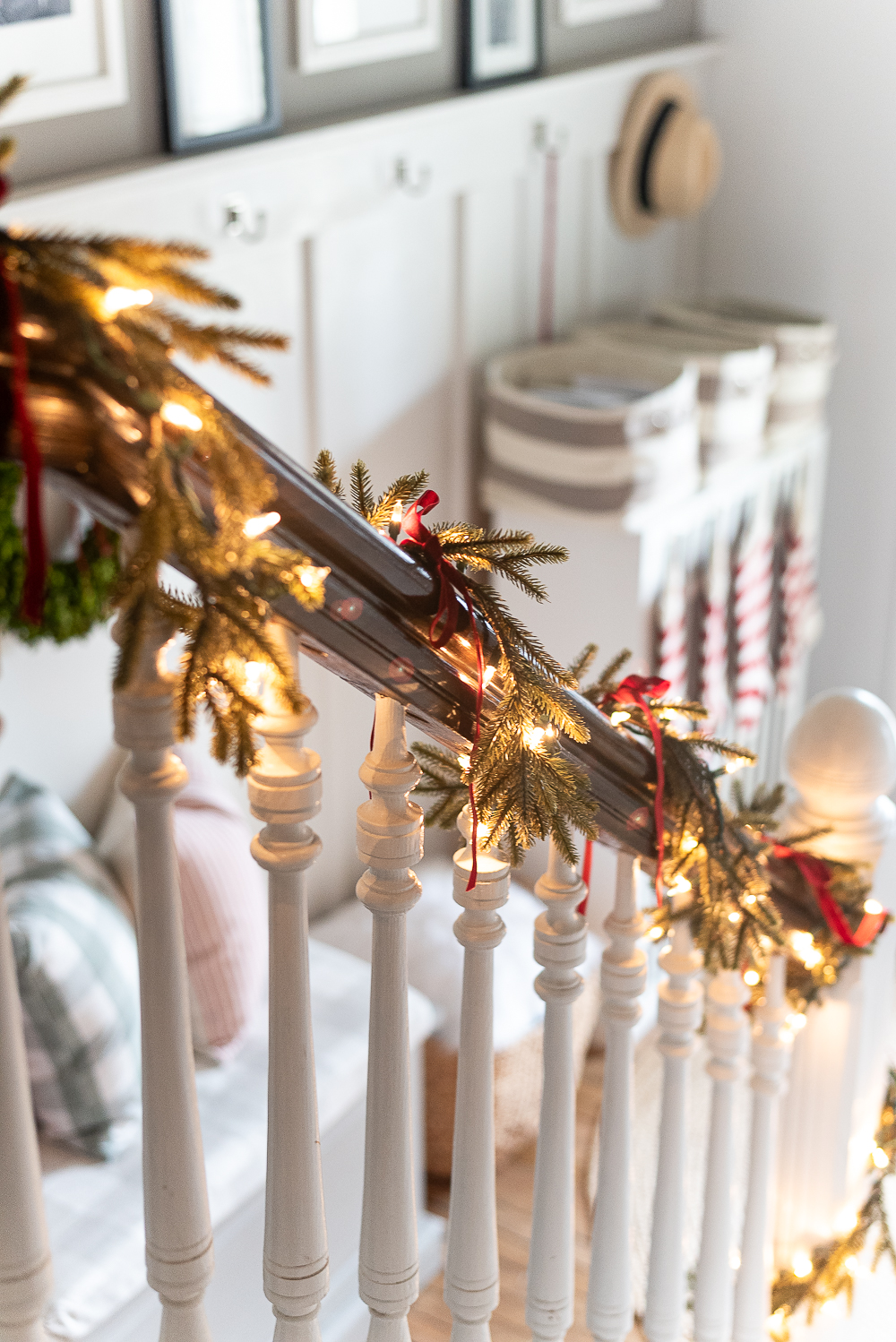 Red, White, Green Christmas Entry Decorating Ideas - Red Velvet Bow on Wreath - Lighted Garland with Red Velvet Bows on Staircase - Decorating Ideas for Entry for Holidays