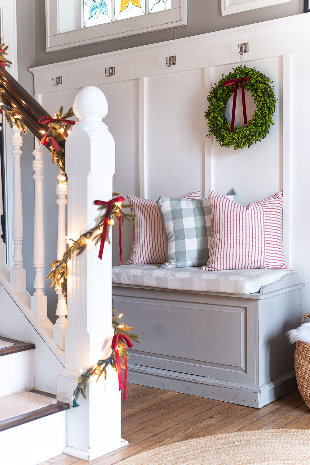 Red, White, Green Christmas Entry Decorating Ideas - Red Velvet Bow on Wreath - Lighted Garland with Red Velvet Bows on Staircase - Decorating Ideas for Entry for Holidays